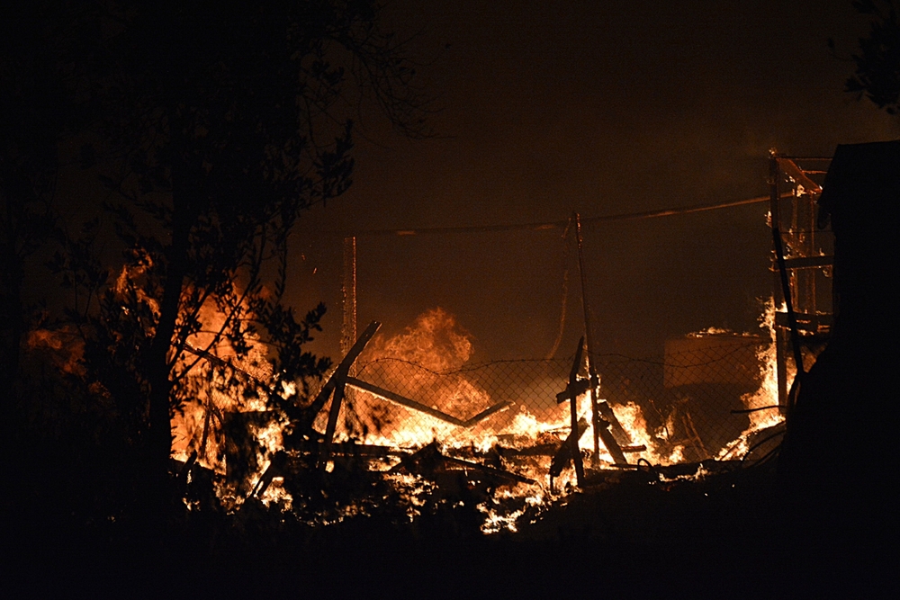 Fire at Moria refugee camp in Greece  / STRATIS BALASKAS